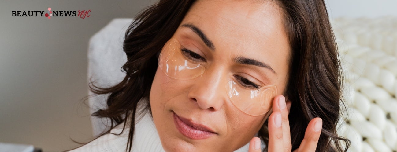 Image of a woman applying the Eye-V Moisture Boost Hydrogel Patches underneath her eyes.