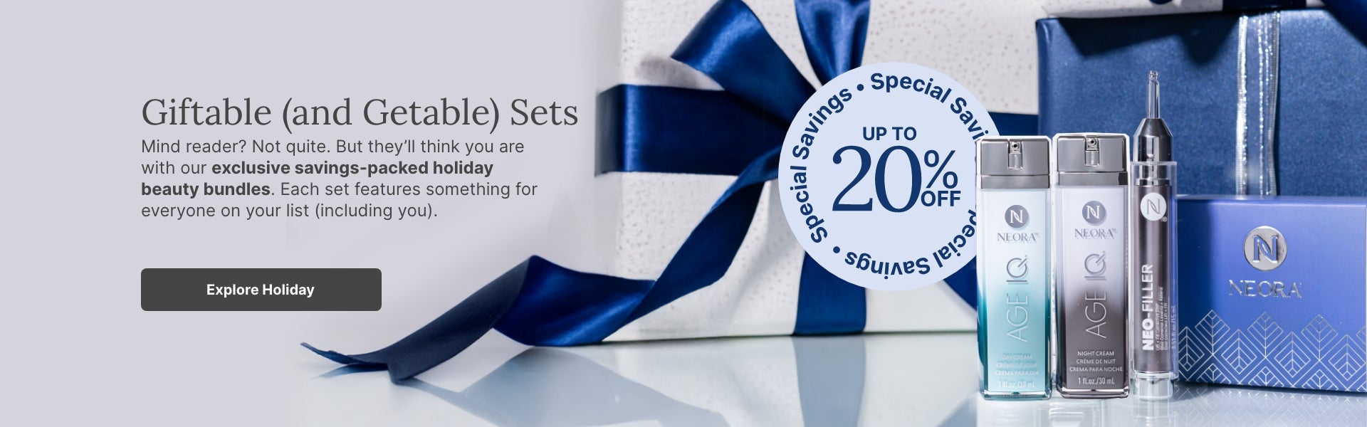 A bundle of Neora skincare products and a blue velvet Neora branded bag surrounded by festive gift boxes. Accompanying text mentions Neora’s newest exclusive holiday beauty bundles that are perfect for gifting to others or yourself.