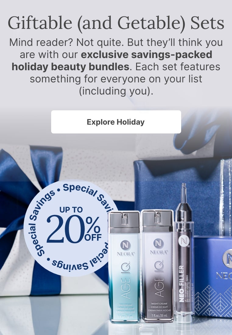 A bundle of Neora skincare products and a blue velvet Neora branded bag surrounded by festive gift boxes. Accompanying text mentions Neora’s newest exclusive holiday beauty bundles that are perfect for gifting to others or yourself