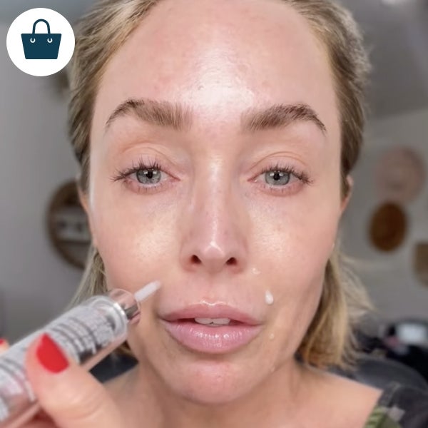 A woman applying NeoFILLER around her lips.