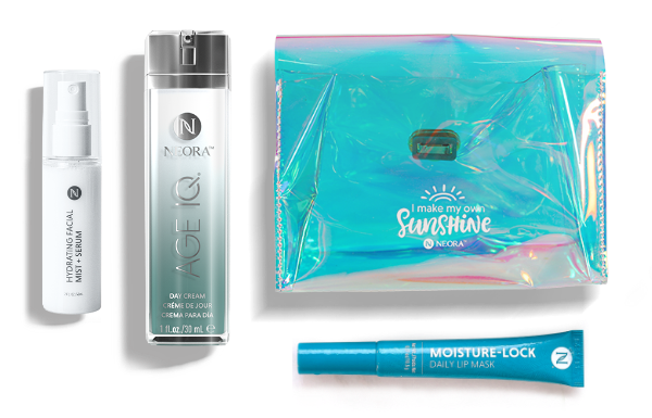 The Summer Skin Essentials Set includes Age IQ Day Cream, Hydrating Facial Mist, a Moisture Lock Lip Mask, and a free Holographic Travel Bag. 