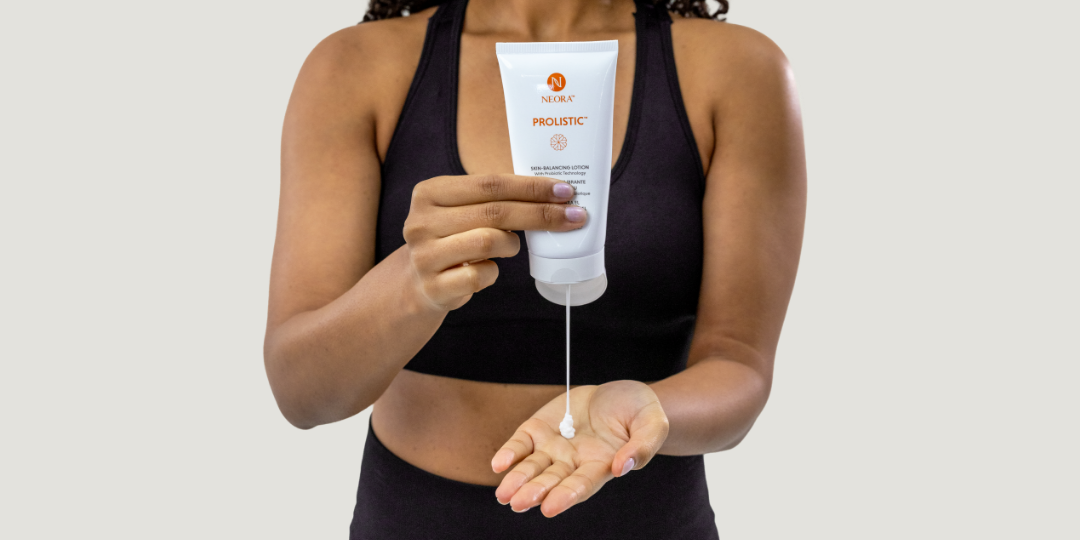 A woman squeezing Prolistic Lotion into her hand.